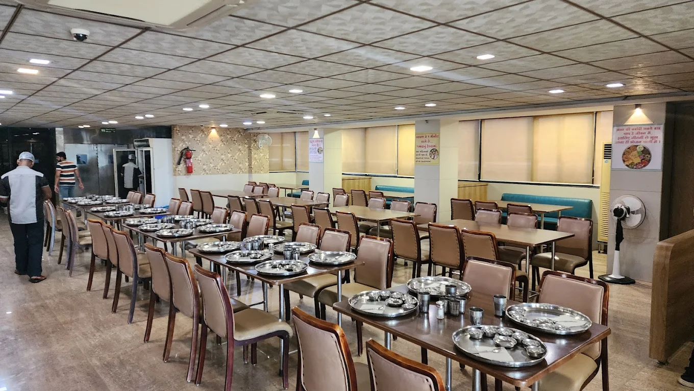 Portrait of pleased client Arjun Patel, resident of Skyline Apartments